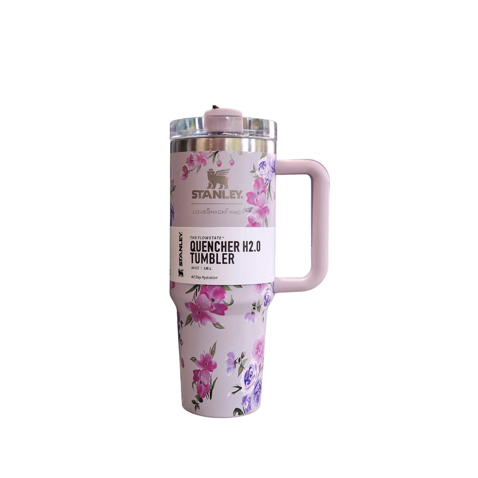 Floral-patterned tumbler with pink handle on a white background